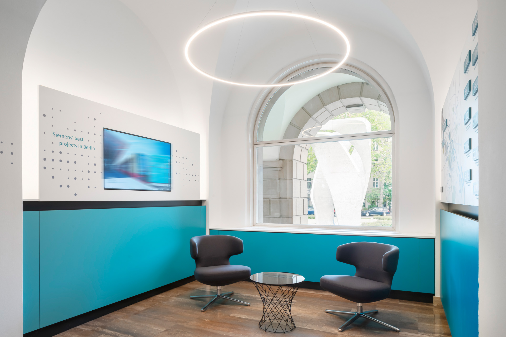 Bright foyer with blue white walls and seating area