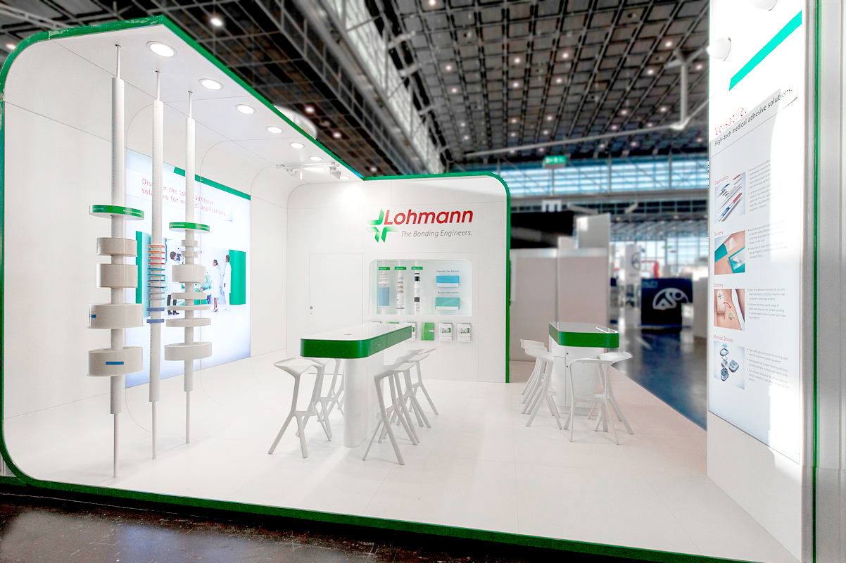 View of a bright exhibition stand with product examples