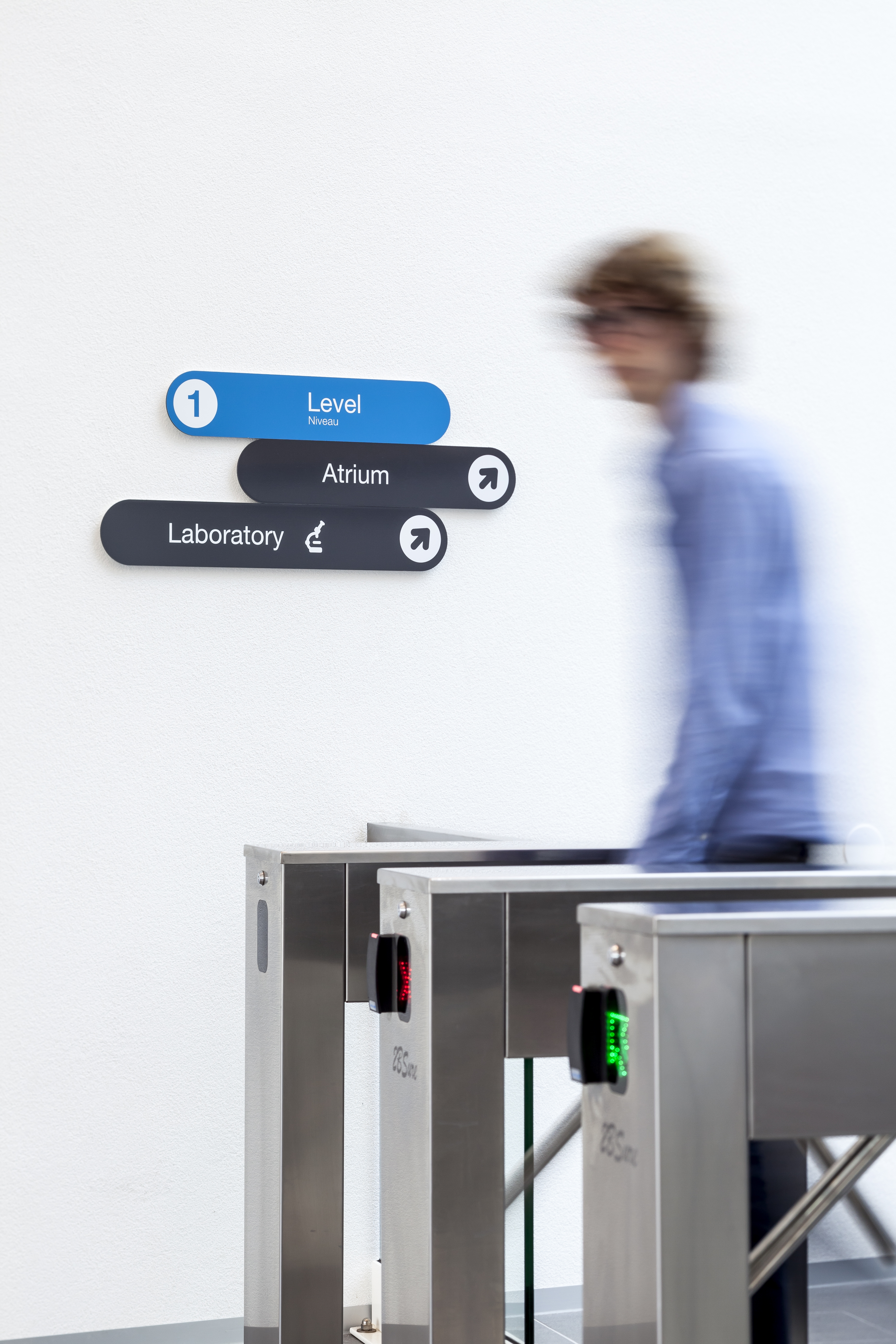 entrance area turnstile visitor with label look signpost