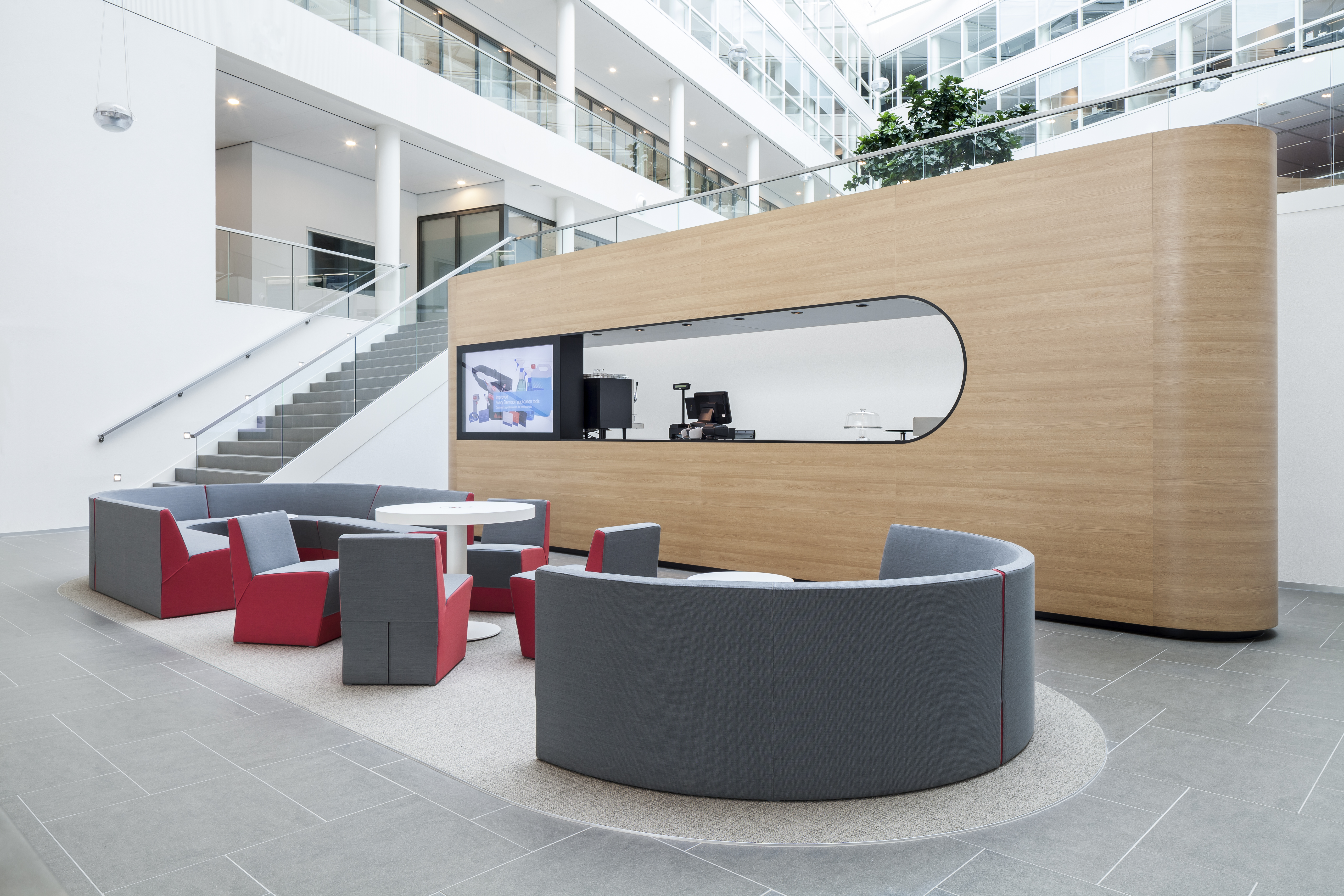 Entrance area of the Experience Center with cosy sitting area and coffee bar