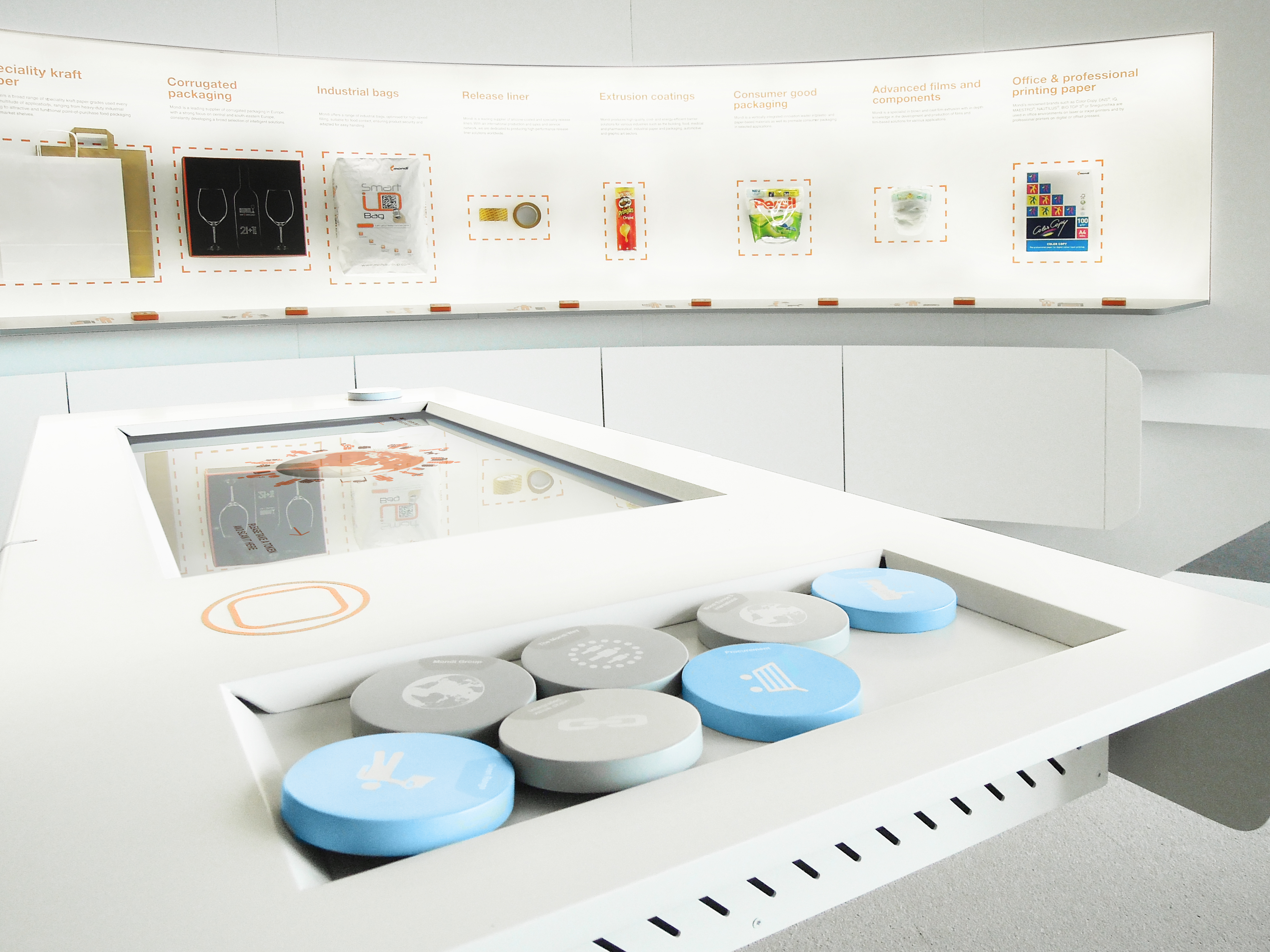 Mondi product samples and interactive table with various themed tokens