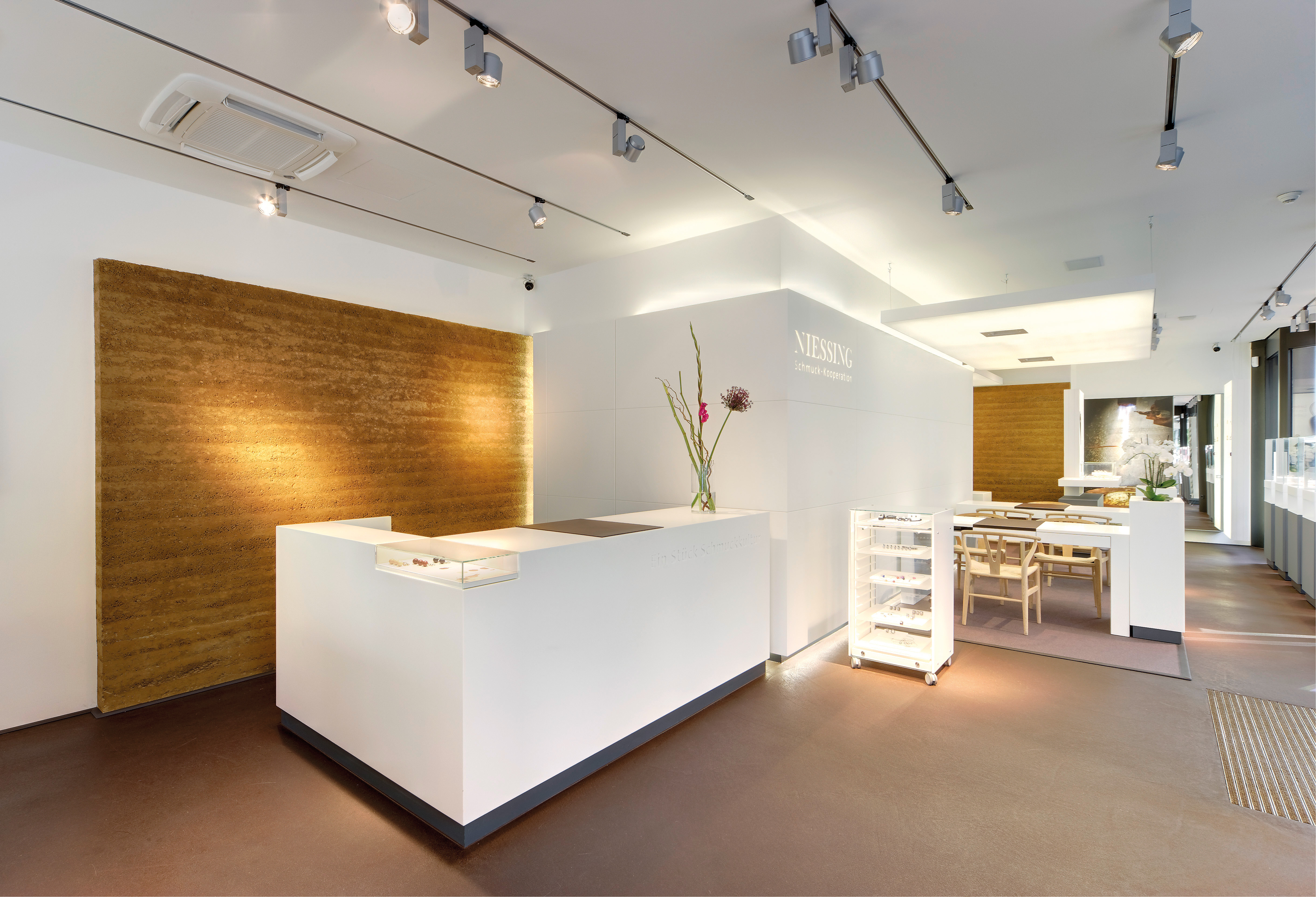 Counter in front of a golden clay wall.