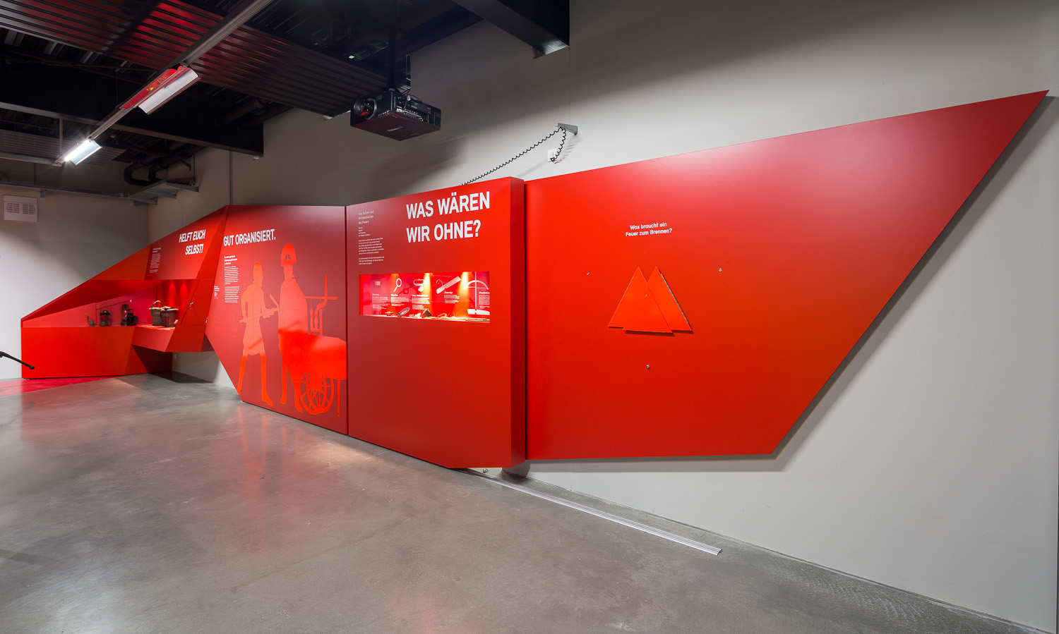 photo fire brigade Red wall with various information about the fire brigadeexperience museum Hermeskeil close-up explanatory wall