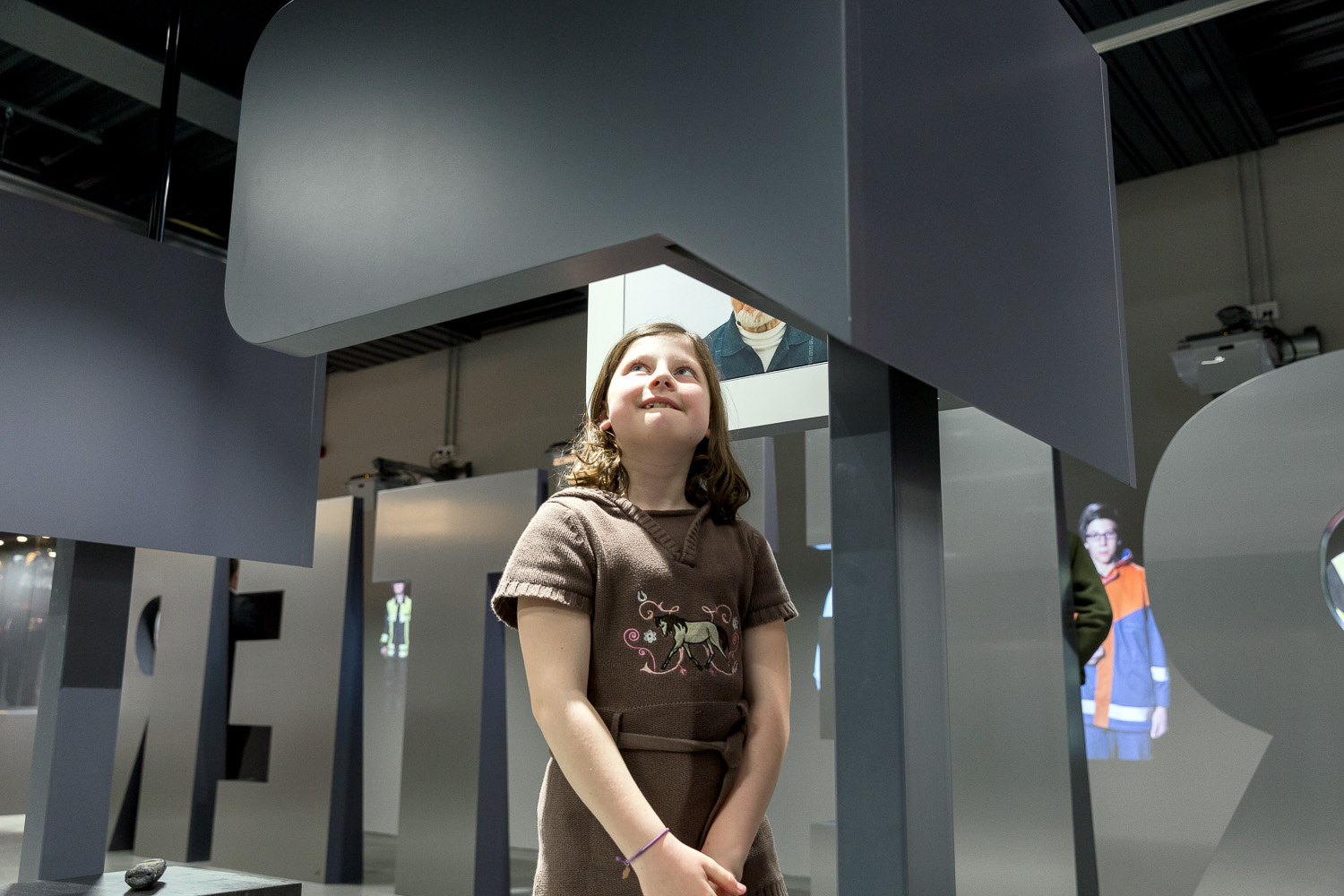 Enthusiastic child takes a look at the exhibition
