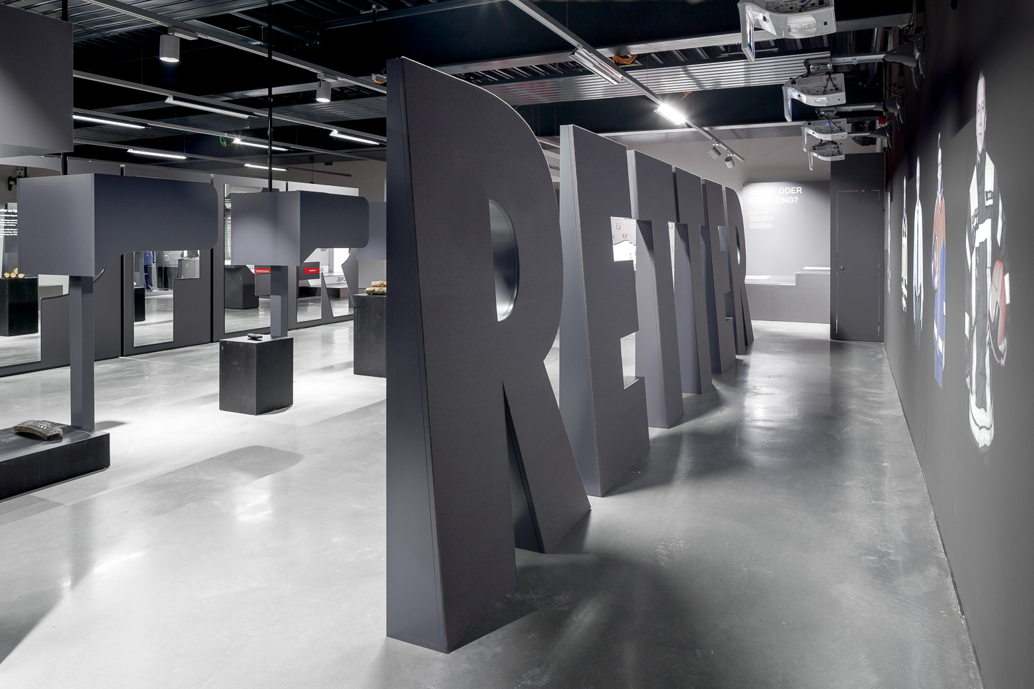 Large black letters and exhibits