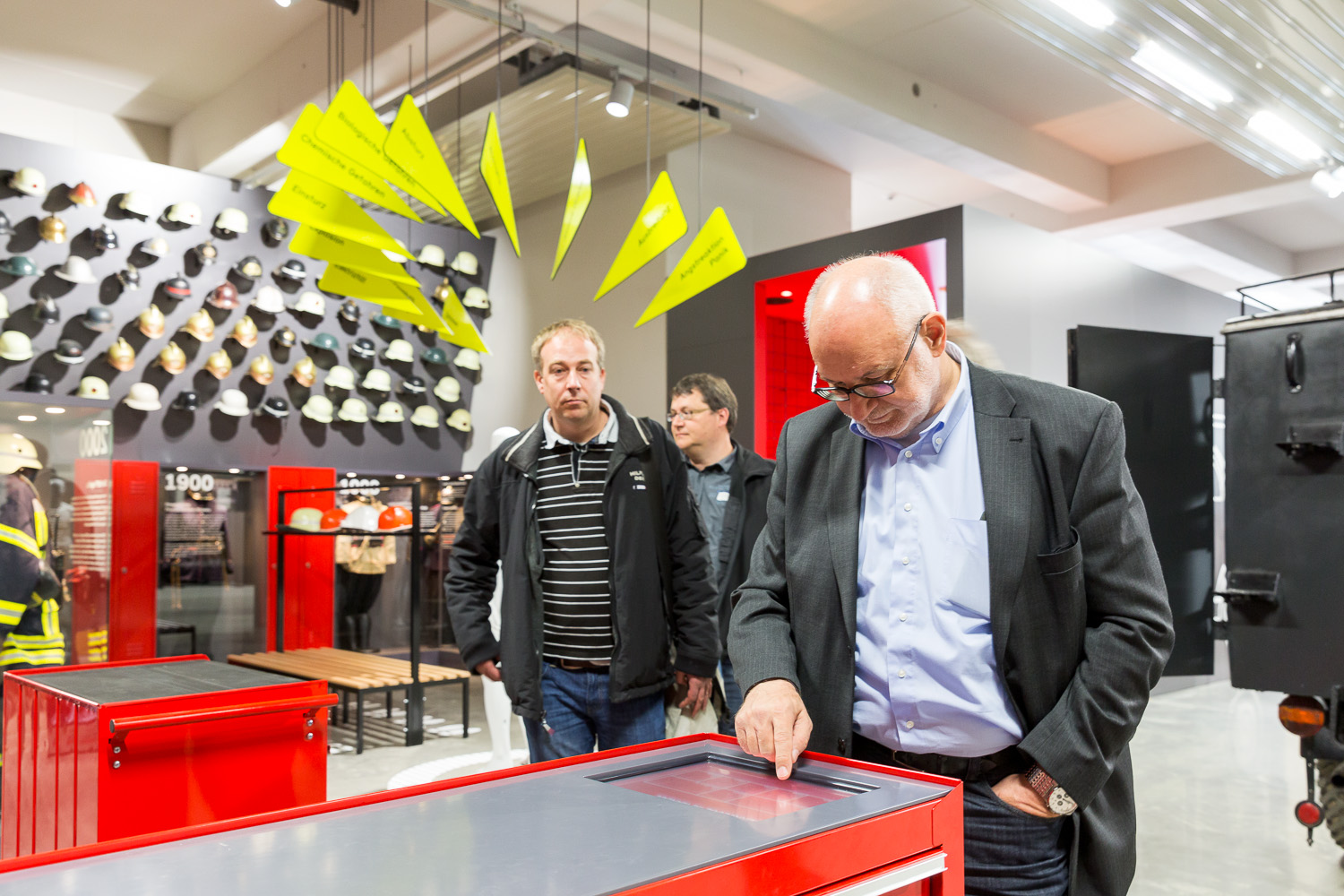 Three visitors take a look at the tools section