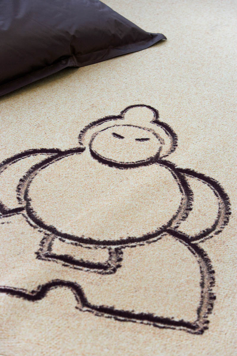 Sumo wrestler logo print on carpet in sand optic