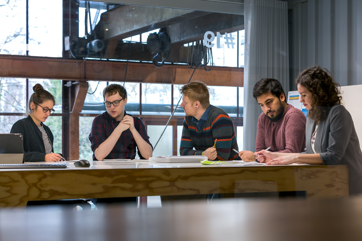 People around the table in a meeting