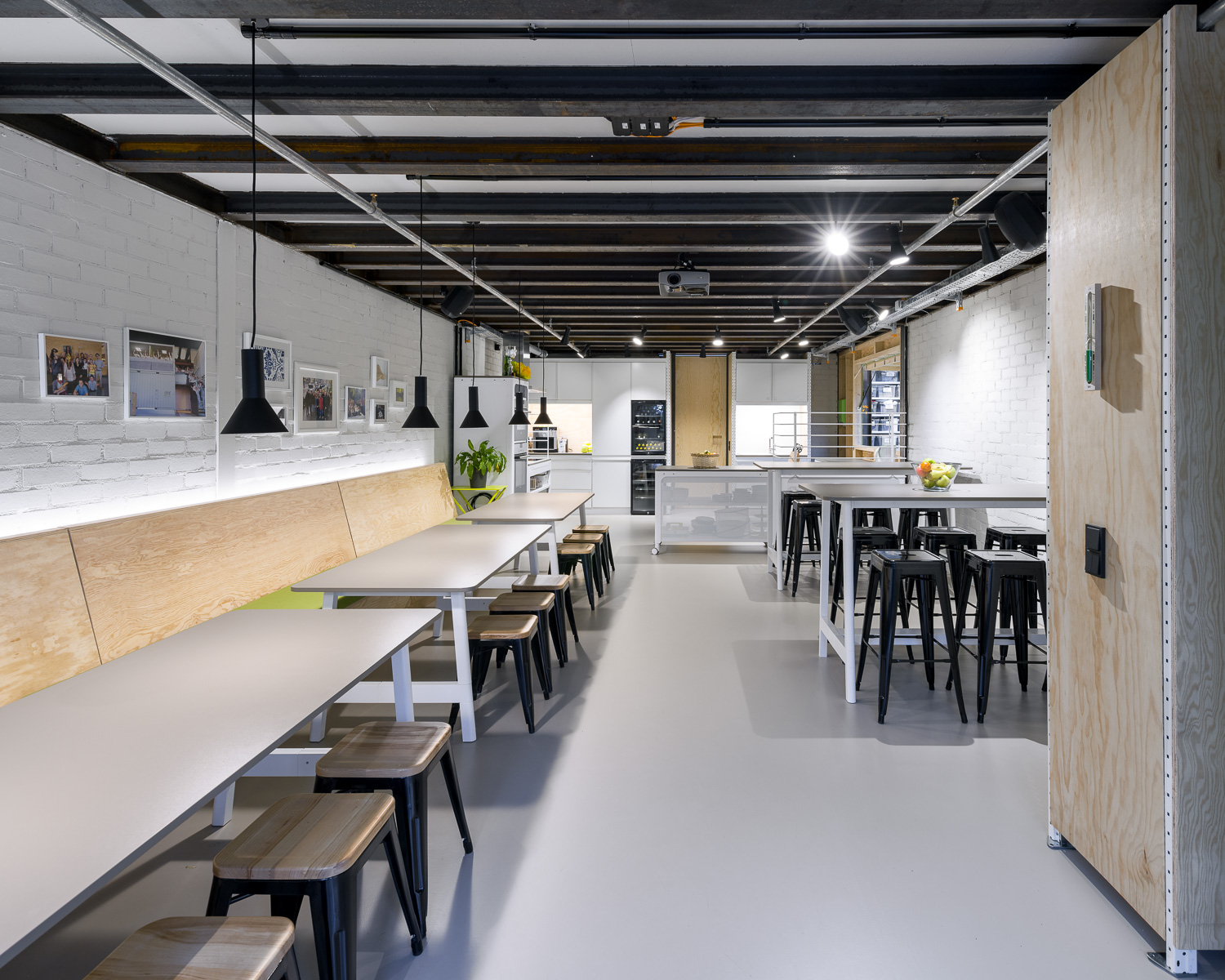 View into the large kitchen with many seats